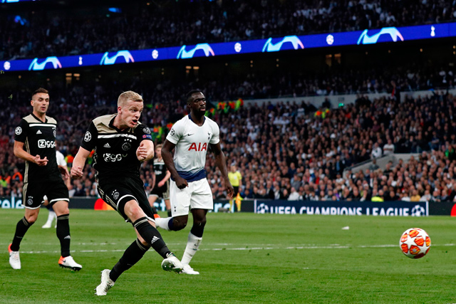 Ajax’s Dutch midfielder Donny van de Beek (2nd left) shoots to score the opening goal of the UEFA Champions League semifinal first leg football match against Tottenham Hotspur in London, on Tuesday  (AFP photo by Adrian Dennis)