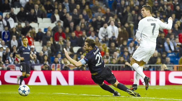 Real Madrid’s Portuguese forward Cristiano Ronaldo (right) kicks the ball to score his fourth goal during the UEFA Champions League Group A football match against Malmo FF in Madrid, on Tuesday (AFP photo by Pierre-Philippe Marcou)