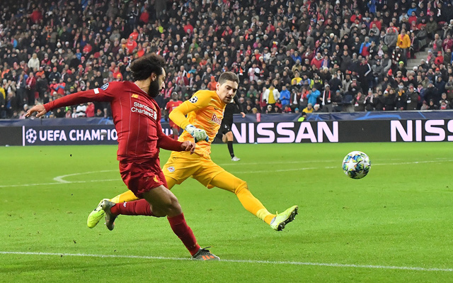 Liverpool’s Egyptian midfielder Mohamed Salah (left) scores during the UEFA Champions League Group E football match against RB Salzburg in Salzburg, Austria, on Tuesday  (AFP photo by Joe Klamar)