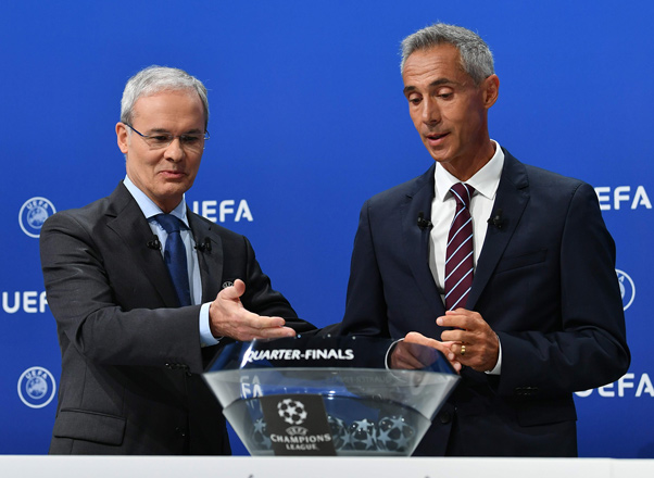 Former Portuguese football player Paulo Sousa delivering a speech next to UEFA secretary General Giorgio Marchetti (left) during the UEFA Champions League 2019/20 final stage draw ceremony at the UEFA headquarters, in Nyon, Switzerland, on Friday  (AFP photo by  Harold Cunningham)