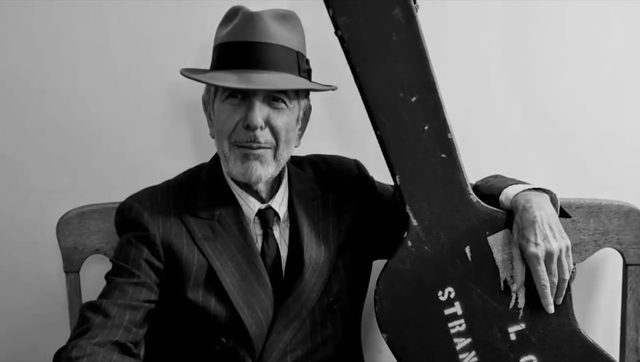 Leonard Cohen with his guitar ready to go on tour circa late-2000s (Photo courtesy of the Cohen Estate)