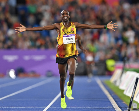 Gold medallist Uganda’s Jacob Kiplimo celebrates as he wins the men’s 10,000m final athletics event at the Commonwealth Games in Birmingham, England, on Tuesday (AFP photo by Glyn Kirk)