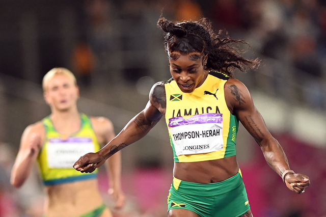 Jamaica’s Elaine Thompson-Herah reacts after setting a new Commonwealth record in the women’s 200m event at the Commonwealth Games in Birmingham, England, on Saturday (AFP photo by Glyn Kirk)