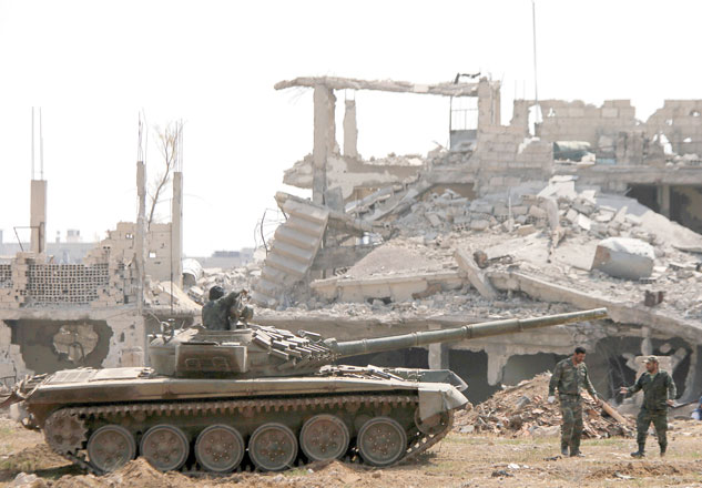 Soldiers loyal to Syria's President Bashar Assad forces are deployed at Al Qadam area near Yarmouk Palestinian camp in Damascus, Syria, on April 29 (Reuters photo)