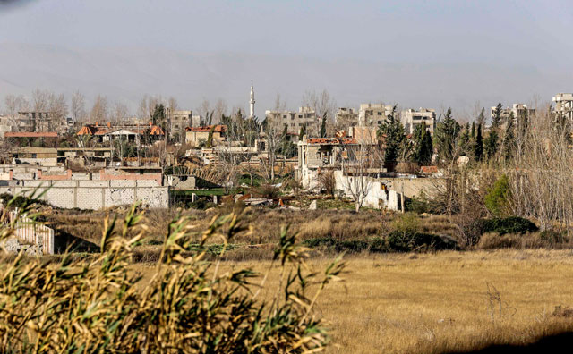 This photo taken on Thursday shows a view from a Syrian government forces’ lookout post of the town of Jisreen in the southern tip of the rebel-held Eastern Ghouta enclave on the eastern outskirts of the capital Damascus (AFP photo)