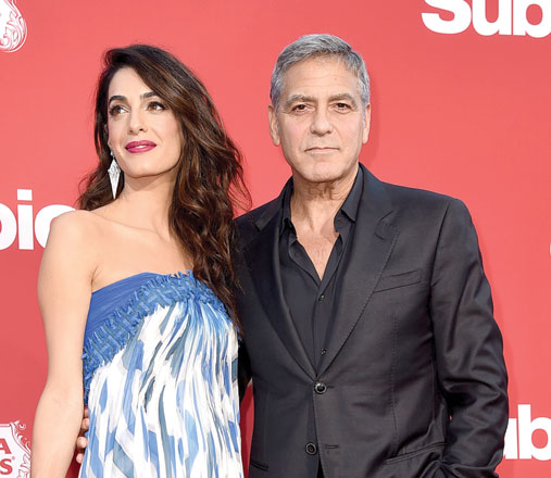  Executive producer George Clooney (right) and his wife Amal Clooney arrive at the premiere of Paramount Pictures’ ‘Suburbicon’ at the Village Theatre in Los Angeles, California, on Sunday (AFP photo by Kevin Winter)