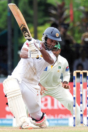 Sri Lankan cricketer Dimuth Karunaratne plays a shot during the final day of the second Test match between Sri Lanka and Pakistan in Colombo on Monday (AFP photo by Lakruwan Wanniarachchi)