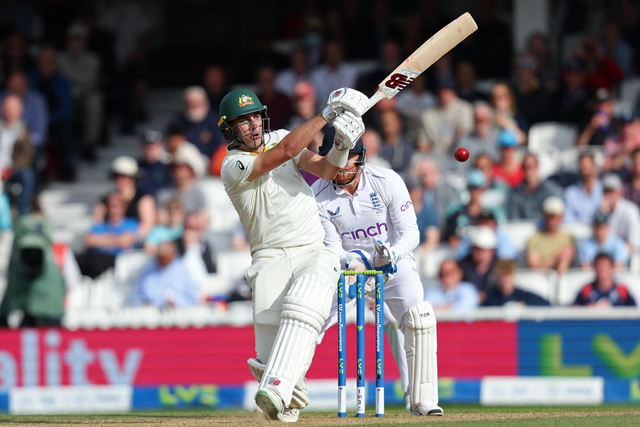 Australia’s Pat Cummins plays a shot off the bowling of England’s Moeen Ali, caught by England’s captain Ben Stokes on day five of their fifth Ashes Test match in London on Monday  (AFP photo by Adrian Dennis)