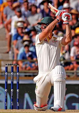 Australia’s Mitchell Marsh hits a boundary during the third day of the third Ashes cricket Test match in Perth on Saturday (Reuters photo by David Gray)