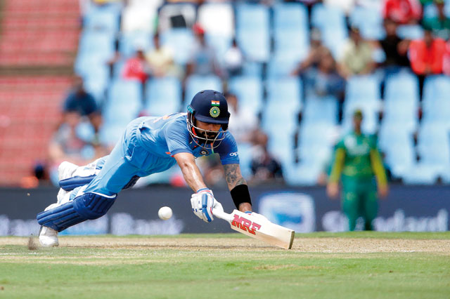 Indian batsman and captain Virat Kohli dives as he avoids a run out during the second day of the One Day International match against South Africa in Centurion, South Africa, on Sunday  (AFP photo by Gianluigi Guercia)