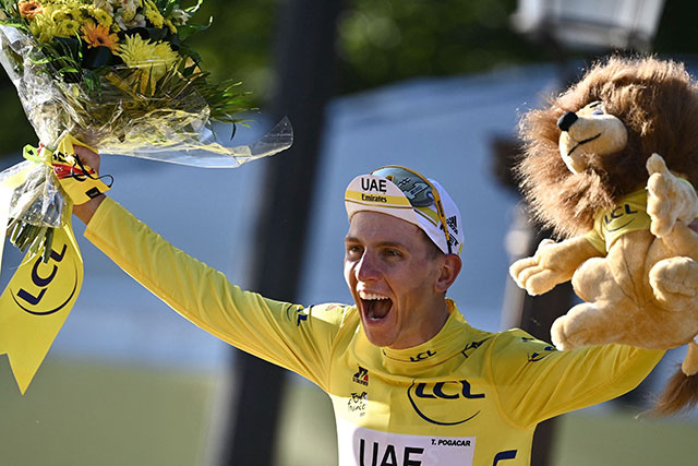 Winner Team UAE Emirates' Tadej Pogacar of Slovenia celebrates winning the 108th edition of the Tour de France cycling race in Paris on Sunday (AFP photo by Anne-Christine Poujoulat)