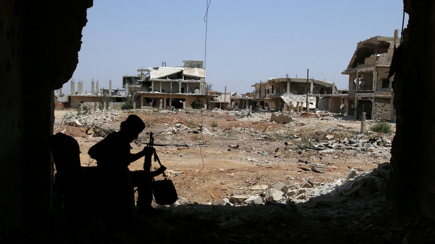  A Free Syrian Army fighter sits with his weapon in al-Manshiyeh neighborhood in Daraa, Syria, July 21, 2017  (Reuters photo)