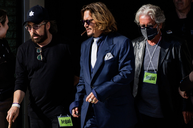 US actor Johnny Depp leaves the Fairfax County Circuit Court after the first day in the lawsuit between him and his former wife, US actress Amber Heard, in Fairfax, Virginia, on Tuesday (AFP photo by Samuel Corum)