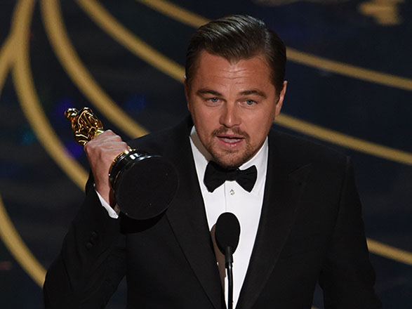 Actor Leonardo DiCaprio accepts the award for Best Actor in,The Revenant on stage at the 88th Oscars on February 28, 2016 in Hollywood, California  (AFP Photo)