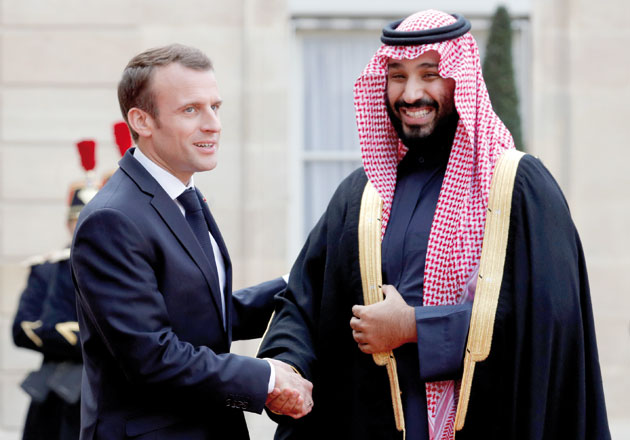 French President Emmanuel Macron welcomes Saudi Arabia’s Crown Prince Mohammed Bin Salman as he arrives at the Elysee Palace in Paris, France, on Tuesday (Reuters photo)