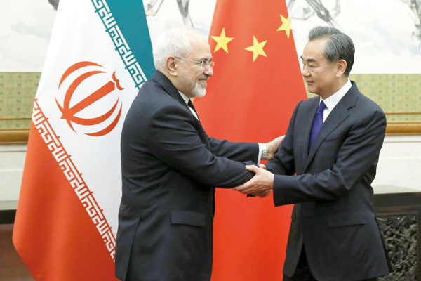 Chinese State Councillor and Foreign Minister Wang Yi meets Iranian Foreign Minister Mohammad Javad Zarif at Diaoyutai state guesthouse in Beijing, China, on Monday (Reuters photo)