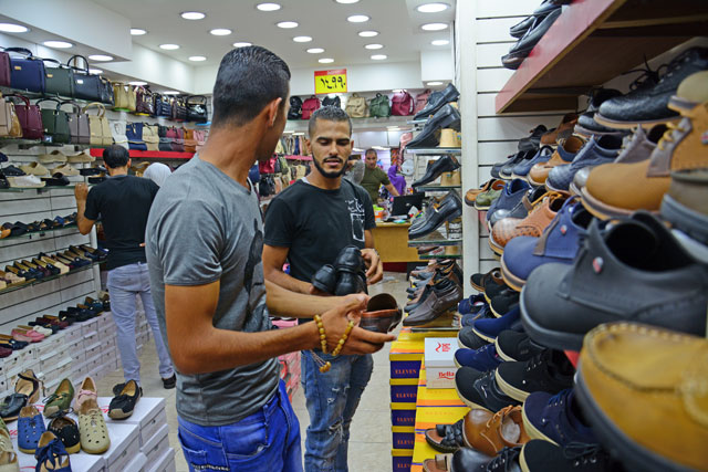   To protect local shops, Jordanians can purchase clothes, shoes, foodstuffs and children's toys up to JD500 each year online, according to new regulations (Photo by Amjad Ghsoun)