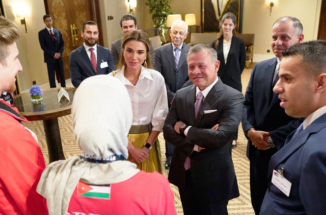 Their Majesties King Abdullah and Queen Rania receive Jordanian athletes from the 2018 Asian Games on Wednesday (Photo courtesy of The Royal Court)
