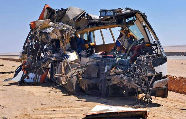 A photo shows the remains of a bus after it crashed into a truck on a road in Al Minya Governorate, south of the the Egyptian capital, on Tuesday (AFP photo)