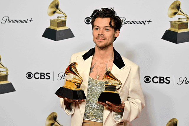  English singer-songwriter Harry Styles poses with the awards for Album Of The Year and Best Pop Vocal Album for “Harry’s House” in the press room during the 65th Annual Grammy Awards in Los Angeles on Sunday (AFP photo by Frederic J. Brown)