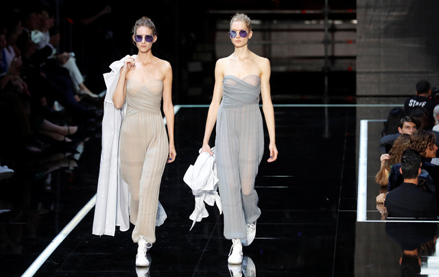 Models present creations during the Emporio Armani show at the Linate Airport during Milan Fashion Week Spring 2019 in Milan, Italy, on Thursday (Reuters photo by Stefano Rellandini)