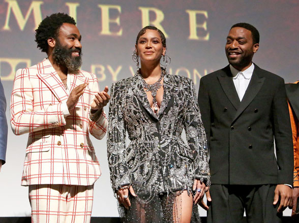 Donald Glover (left), Beyoncé Knowles-Carter and Chiwetel Ejiofor (right) appear on stage before the screening of ‘Lion King’ at its World premiere in Hollywood at the Dolby Theatre on Tuesday (AFP photo by Jesse Grant)