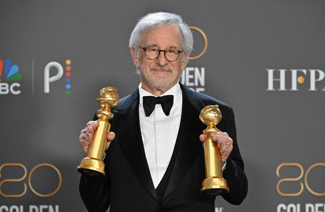 US director Steven Spielberg poses with the awards for Best Director — Motion Picture and Best Picture — Drama for ‘The Fabelmans’ in the pressroom during the 80th annual Golden Globe Awards in Beverly Hills, California, on Tuesday (AFP photo by Frederic J. Brown)