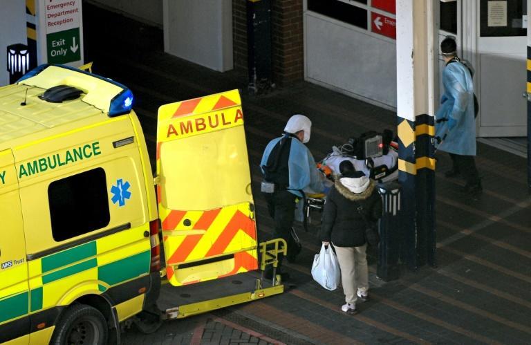 Paramedics unload a patient from an ambulance after arriving at Leeds General Infirmary hospital in Leeds, northern England on Wednesday (AFP photo by Oli Scarff)