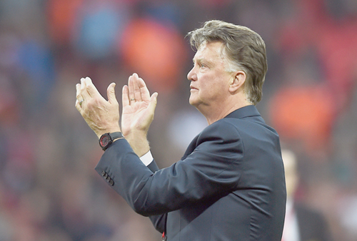 Manchester United manager, Louis Van Gaal, applauds the fans after winning the FA Cup final against Crystal Palace in London on Saturday (Reuters photo by Dylan Martinez)