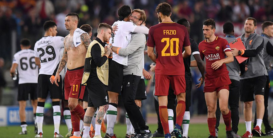 Liverpool manager Juergen Klopp celebrates with Virgil van Dijk after their Champions League semifinal second leg match against Roma in Rome, Italy, on Wednesday (Reuters photo)