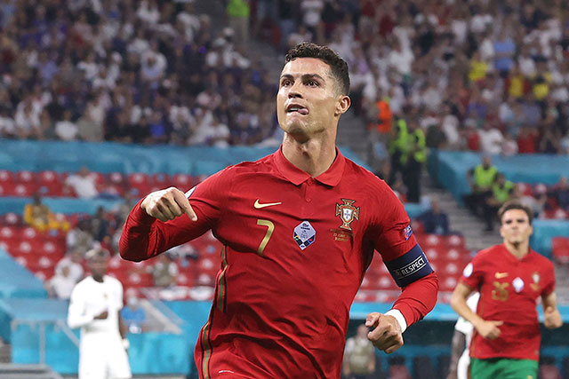 Portugal's forward Cristiano Ronaldo celebrates after scoring against France during their UEFA Euro 2020 Group F match in Budapest on Wednesday (AFP photo by Bernadett Szabo)