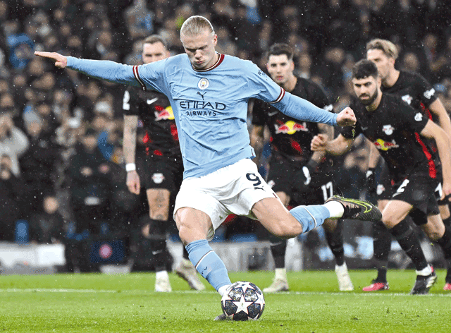 Manchester City’s Norwegian striker Erling Haaland shoots from the penalty spot to score against Leipzig during the UEFA Champions League round of 16 second-leg match in Manchester, England, on Tuesday (AFP photo by Paul Ellis)