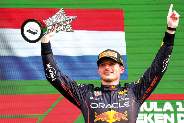 Red Bull Racing’s Dutch driver Max Verstappen holds the winner’s trophy on the podium of the Dutch Formula One Grand Prix at the Zandvoort circuit on Sunday  (AFP photo by Kenzo Tribouillard)