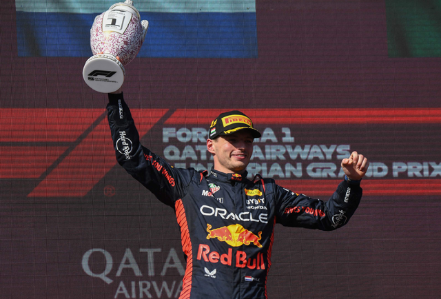 Red Bull Racing’s Dutch driver Max Verstappen celebrates on the podium after winning the Formula One Hungarian Grand Prix in Mogyorod on Sunday (AFP photo by Ferenc Isza)