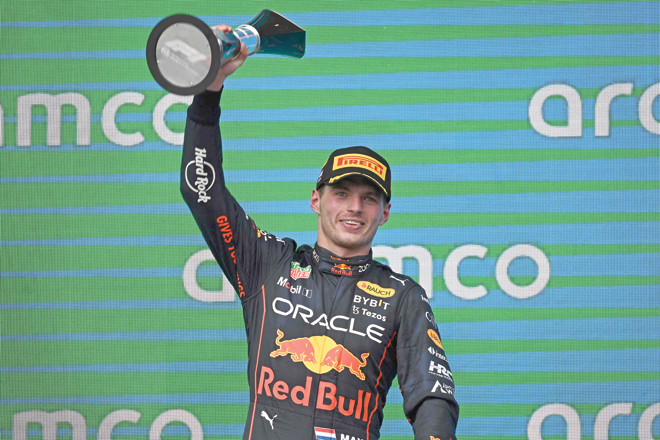 Red Bull Racing’s Dutch driver Max Verstappen celebrates on the podium after winning the Formula One United States Grand Prix in Austin, Texas, on Sunday  (AFP photo by Patrick T. Fallon)