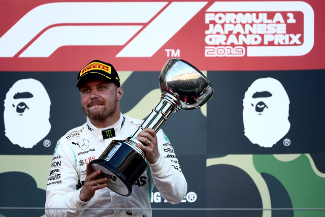Mercedes’ Finnish driver Valtteri Bottas celebrates his victory on the podium at the end of the Formula One Japanese Grand Prix final at Suzuka on Sunday  (AFP photo by Behrouz Mehri)