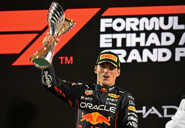 Red Bull’s Dutch driver Max Verstappen raises the winner’s trophy on the podium after the Abu Dhabi Formula One Grand Prix on Sunday (AFP photo by Karim Sahib)