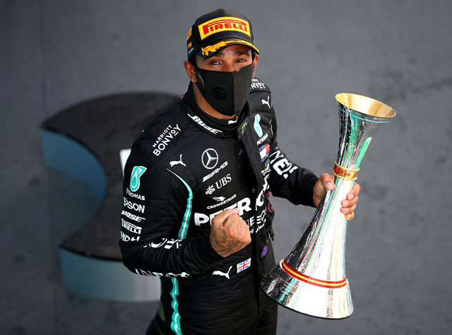 Mercedes’ British driver Lewis Hamilton celebrates on the podium after the Spanish Formula One Grand Prix in Montmelo on Sunday (AFP photo by Bryn Lennon)