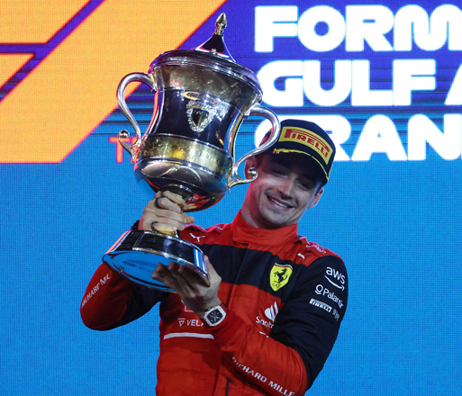 Ferrari’s Monegasque driver Charles Leclerc celebrates on the podium winning the Bahrain Formula One Grand Prix at the Bahrain International Circuit in Sakhir on Sunday  (AFP photo by Giuseppe Cacace)
