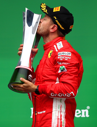  Race winner Ferrari’s Sebastian Vettel of Germany celebrates on the podium after  winning the Canadian Formula One Grand Prix in Montreal, Canada, on Sunday (AFP photo by Dan Istitene)