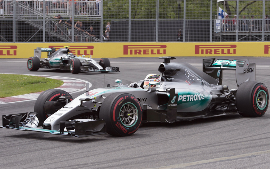 Mercedes driver Lewis Hamilton, of Great Britain, steers his car at the hairpin followed by teammate Nico Rosberg, of Germany, during the Canadian Grand Prix in Montreal on Sunday (AP photo by Jacques Boissinot)