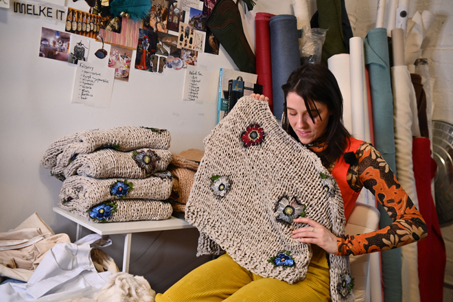 Fashion designer Emma Gage, of Melke, works at her studio ahead of New York Fashion Week in New York City, on February 4  (AFP photo by Angela Weiss)