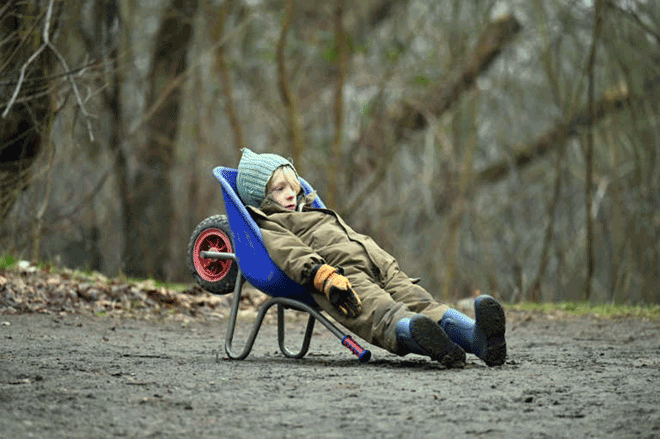 Living the dream: a young boy chills in a wheelbarrow at a forest school in Ballerup, Denmark (AFP photo by Sergei Gapon)