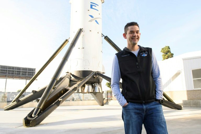 Inspiration4 mission commander Jared Isaacman, founder and chief executive officer of Shift4 Payments, stands for a portrait in front of the recovered first stage of a Falcon 9 rocket at Space Exploration Technologies Corp. (AFP photo)