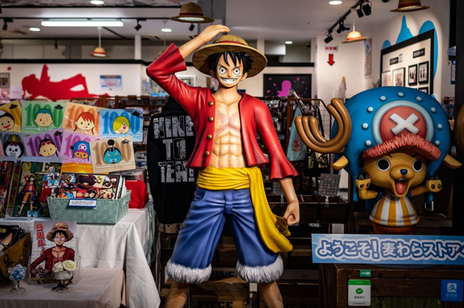 A statue of the character Monkey D. Luffy, also known as Straw Hat, is displayed at the ‘One Piece’ anime souvenir shop in Tokyo on November 19, 2021 (AFP photo by Philip Fong)
