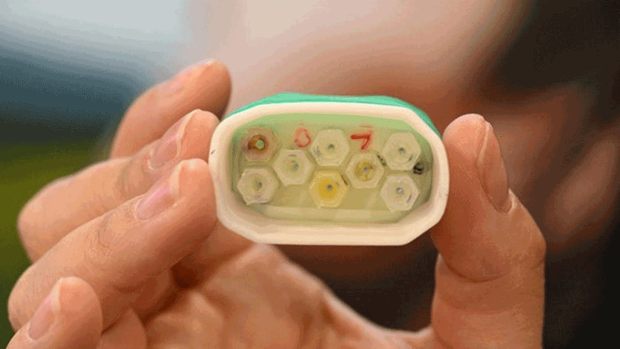 Sarah Socia, of OVR Technology, displays the scent cartridge of the ION 3, a wearable scent technology which delivers factory smells which correlate with items a user interacts with in the VR and AR environment, during the Consumer Electronics Show in Las Vegas, Nevada, on Friday (AFP photo)