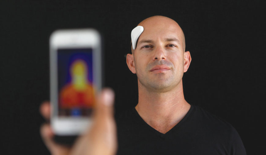  Dan Wetmore demonstrates the Thync, a Bluetooth-connected wearable device that sends electronic pulses to your cranial nerves to either make you calmer or more energised, in a file photo at Thync in Los Gatos, California (Photo courtesy of siliconvalley.com)