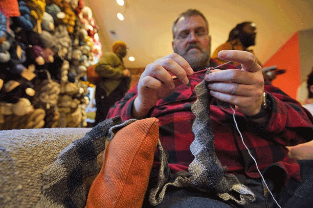 Devlin Breckenridge, an interpreter who has been crocheting for about 15 years, attends a gathering of DC Men Knit in Alexandria, Virginia, on March 5 (AFP photo by Agnes Bun)