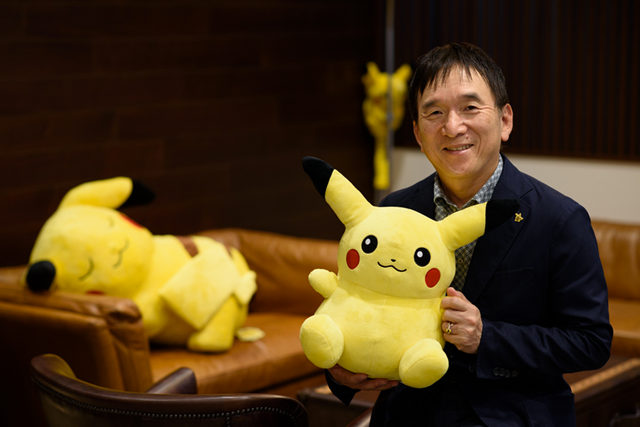 Tsunekazu Ishihara, president of Pokémon Company, holds Pikachu character (AFP photo by Akio Kon)