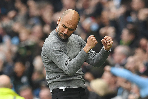 In this file photo taken on April 7 Manchester City’s Spanish manager Pep Guardiola celebrates Manchester City’s German midfielder Ilkay Gundogan (unseen) scored the second goal during the English Premier League football match between Manchester City and Manchester United in Manchester, north west England (AFP photo)